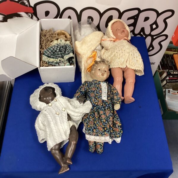 Vintage doll lot with clothing, antique toys for collectors.