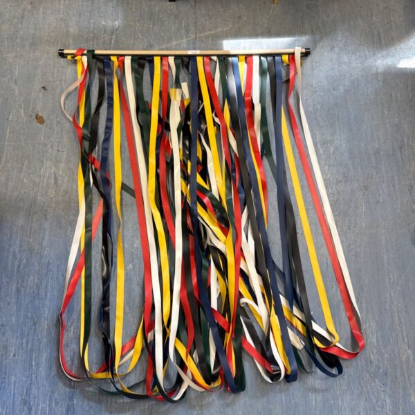 Vintage door fly screen with colourful plastic strips.