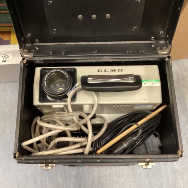 Vintage Elmo projector inside its original hard case.