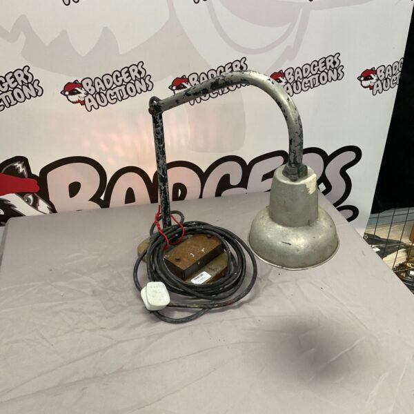 Vintage engineers desk lamp with adjustable arm and green shade.