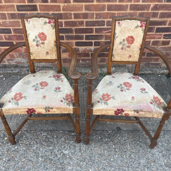 Vintage floral bedroom chairs with turned legs and needlepoint upholstery.