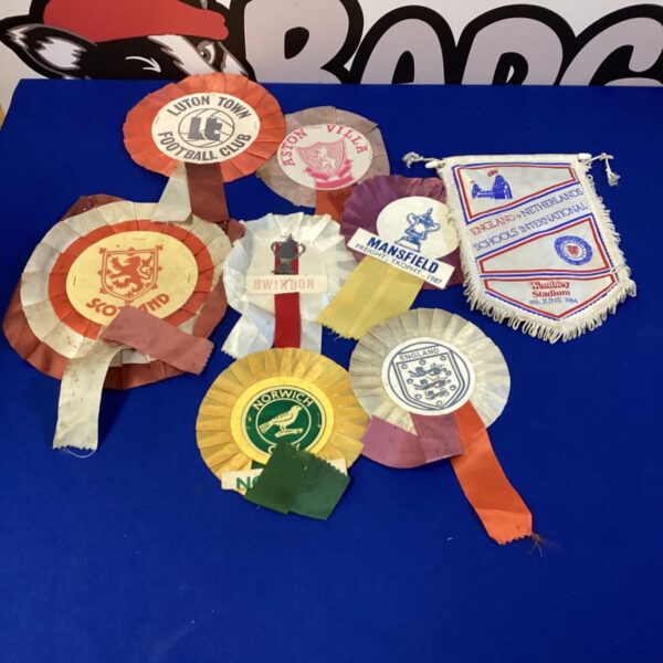 Vintage football ribbons and a Wembley plaque from 1984.