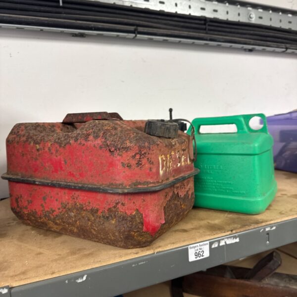 Pair of vintage fuel cans, including a metal diesel can.