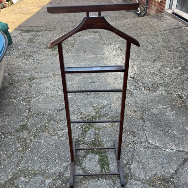 Vintage dark wood gentleman's valet stand for coats and trousers.