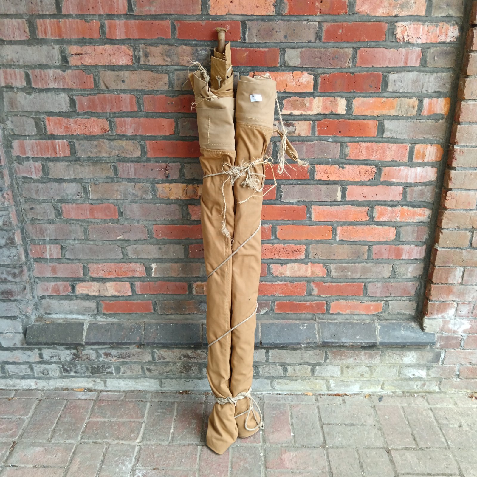 Vintage Girl Guide canvas shelter showing signs of age.