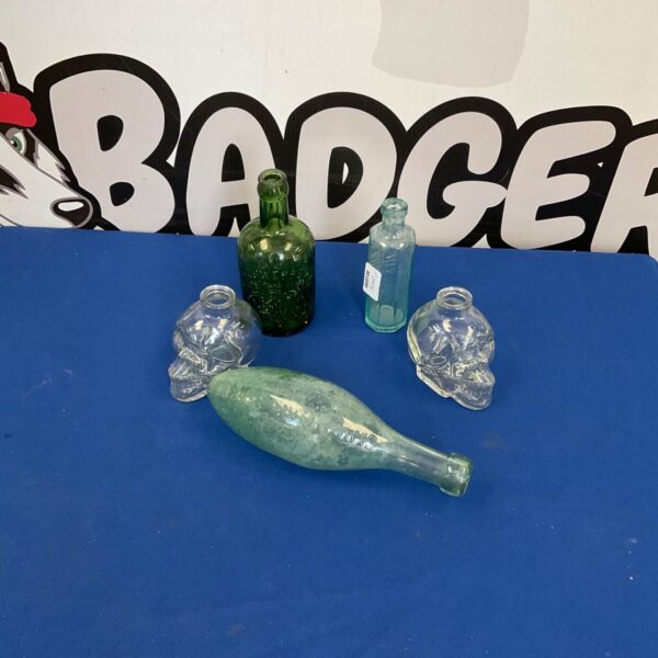 Assorted vintage glass bottles, a collectible lot for enthusiasts.