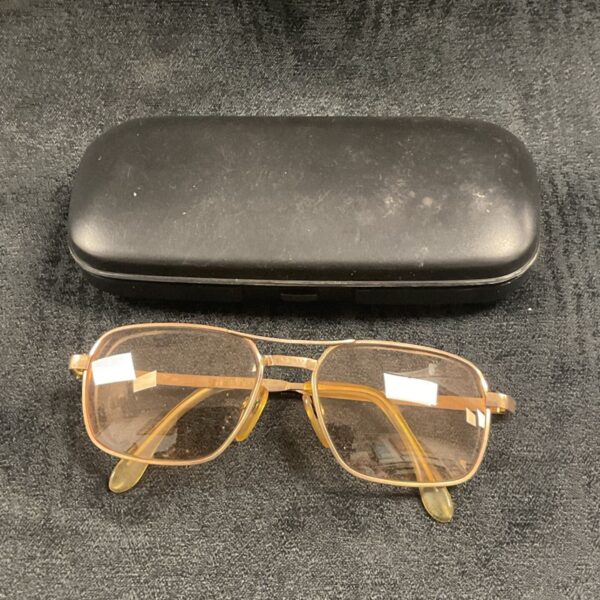 Vintage gold glasses with a protective case.