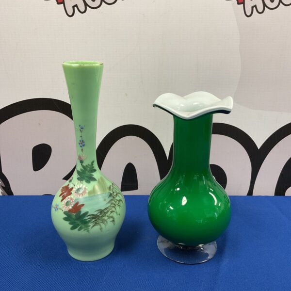 Vintage green glass vases with hand-painted floral design.