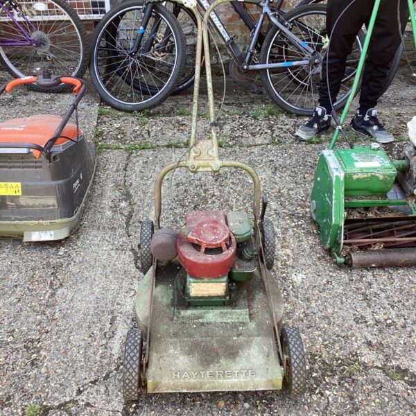 Vintage Hayterette lawn mower in a garden setting.