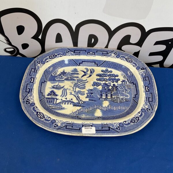 Vintage ironstone platter with blue and white landscape transferware design.