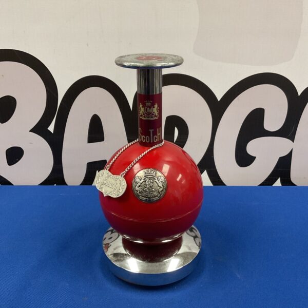 Vintage Japanese musical cigarette dispenser with red sphere and charms.