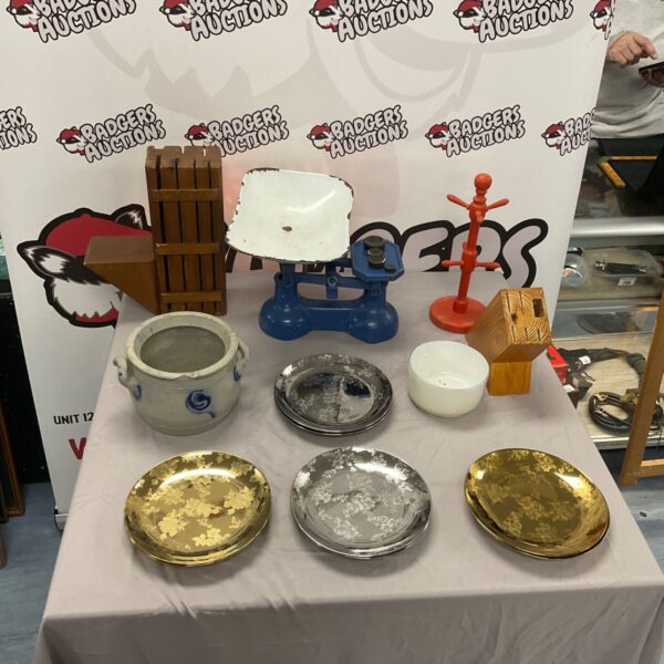 Vintage kitchenware collection including scales and plates.