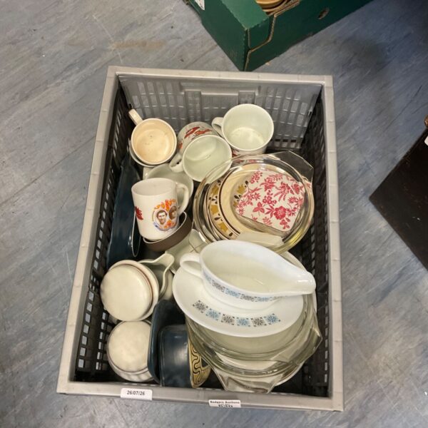 Vintage kitchenware lot featuring floral china and Pyrex dishes.