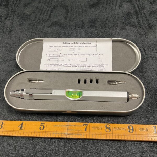 Vintage laser level tool set in original tin case.