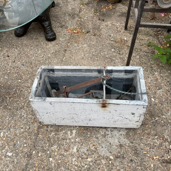Vintage lead lined toilet cistern with flushing lever mechanism.