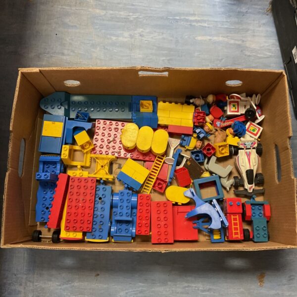 Tray of vintage Lego Duplo bricks for building and play.