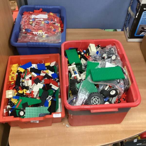 Three boxes of vintage Lego building bricks for creative play.
