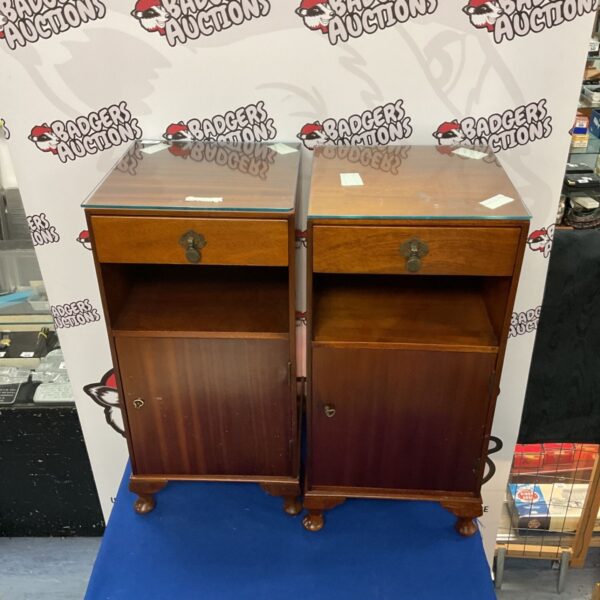 Vintage mahogany bedside cabinets with glass tops.