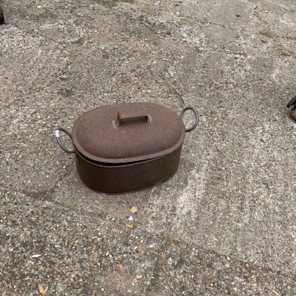 Vintage metal coal box with rust and patina.