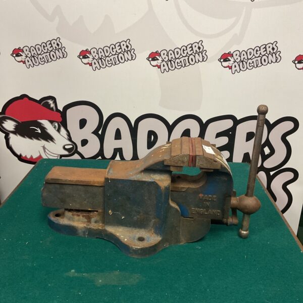 Vintage metal vise, a classic workshop tool with signs of age.