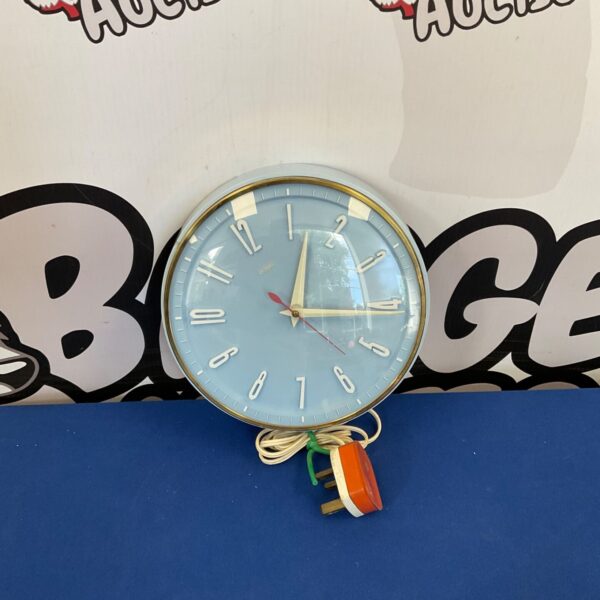 Vintage Metamec wall clock with a minimalist face and bold design.