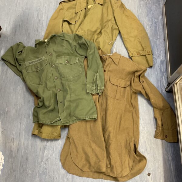 Vintage lot of three military shirts from WWII, British, and Vietnam eras.