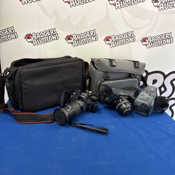 Vintage Minolta cameras lot with cases, including models 5000 and 7000.