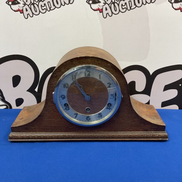 Vintage Napoleon hat mantle clock with key and pendulum.