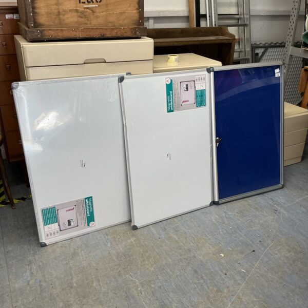 Vintage notice board with two whiteboards and storage section.
