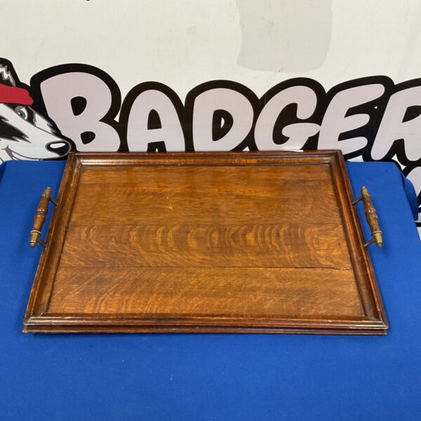 Vintage oak butlers tray with wooden handles, ideal for serving.