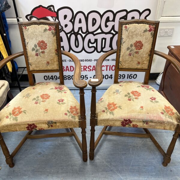 Vintage oak hall chairs with floral upholstery, antique seating.