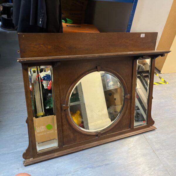 Vintage 1930s oak overmantel mirror with arched design.