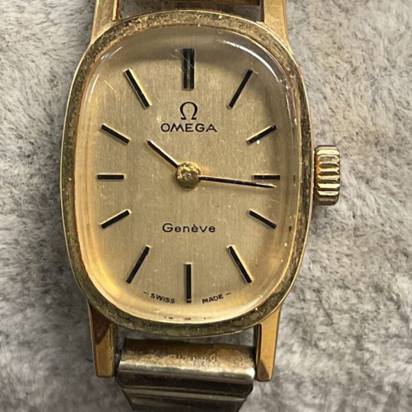 Vintage Omega Geneve ladies wristwatch with gold bracelet.