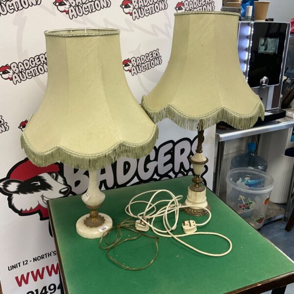 Pair of vintage onyx table lamps with cream shades.
