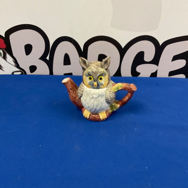 Vintage porcelain owl teapot, a charming collectible for tea lovers.