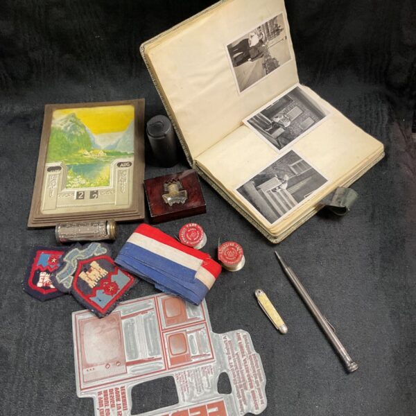 Vintage photograph album with ephemera and a Ferranti component.