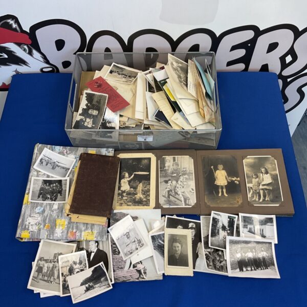Vintage photograph collection with postcards and ephemera.