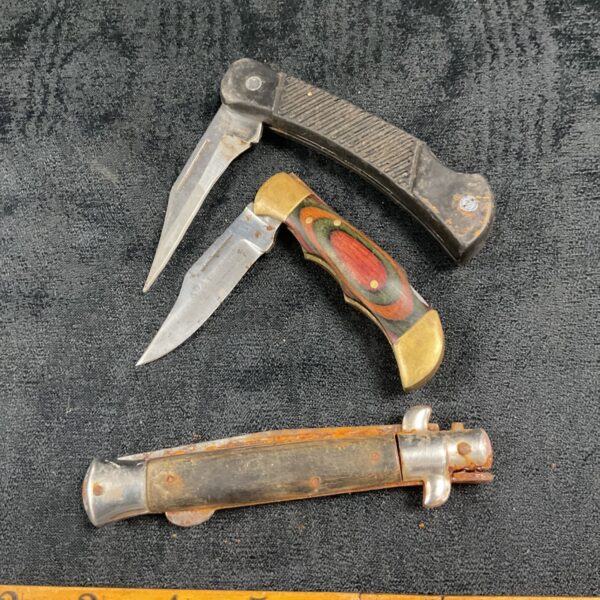 Vintage pocket knife with bone handle and steel blade.