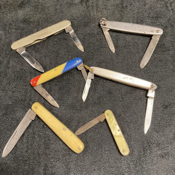 Lot of six vintage pocket knives with celluloid handles.