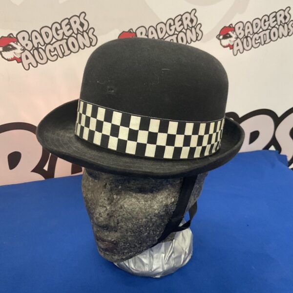 Vintage police helmet, a collectible piece of historic law enforcement headwear.