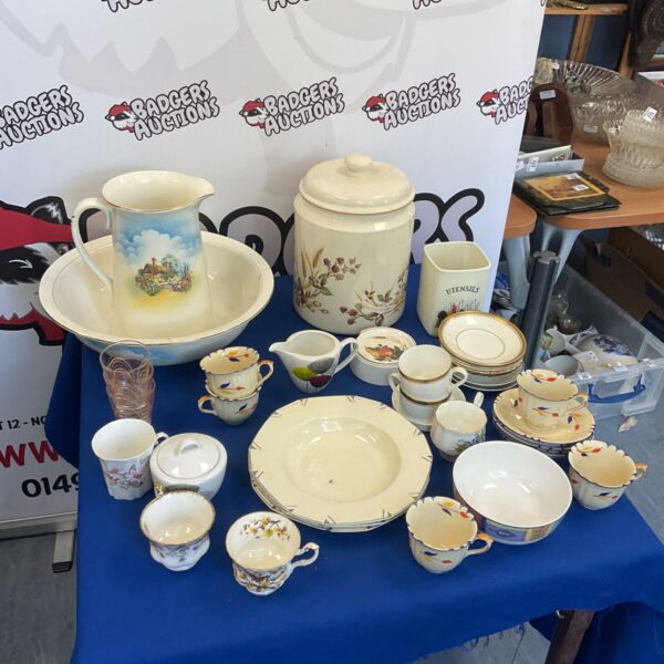 Vintage porcelain wash set with floral design, including bowl and jug.