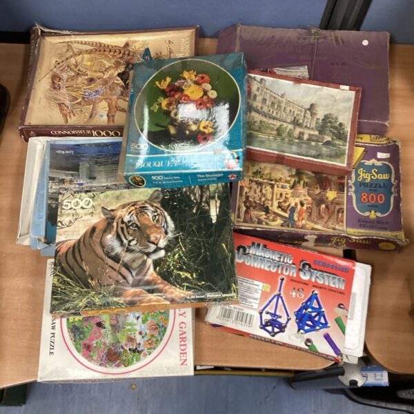Vintage jigsaw puzzle bundle with colourful boxes.