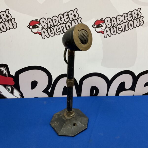 Vintage radio microphone from the 1940s or 1950s, showing wear.