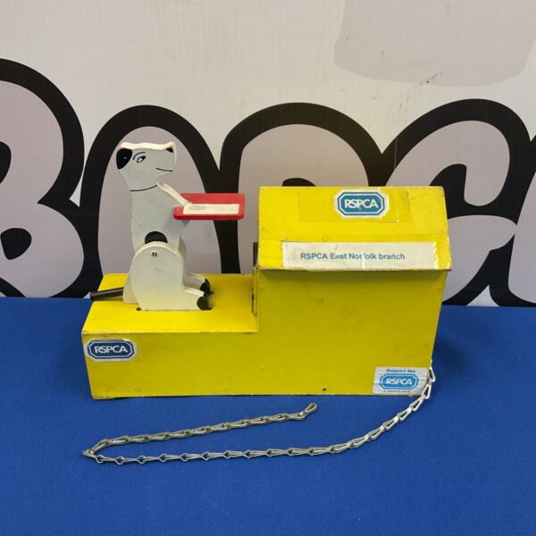 Vintage RSPCA dog collection box for charity donations.