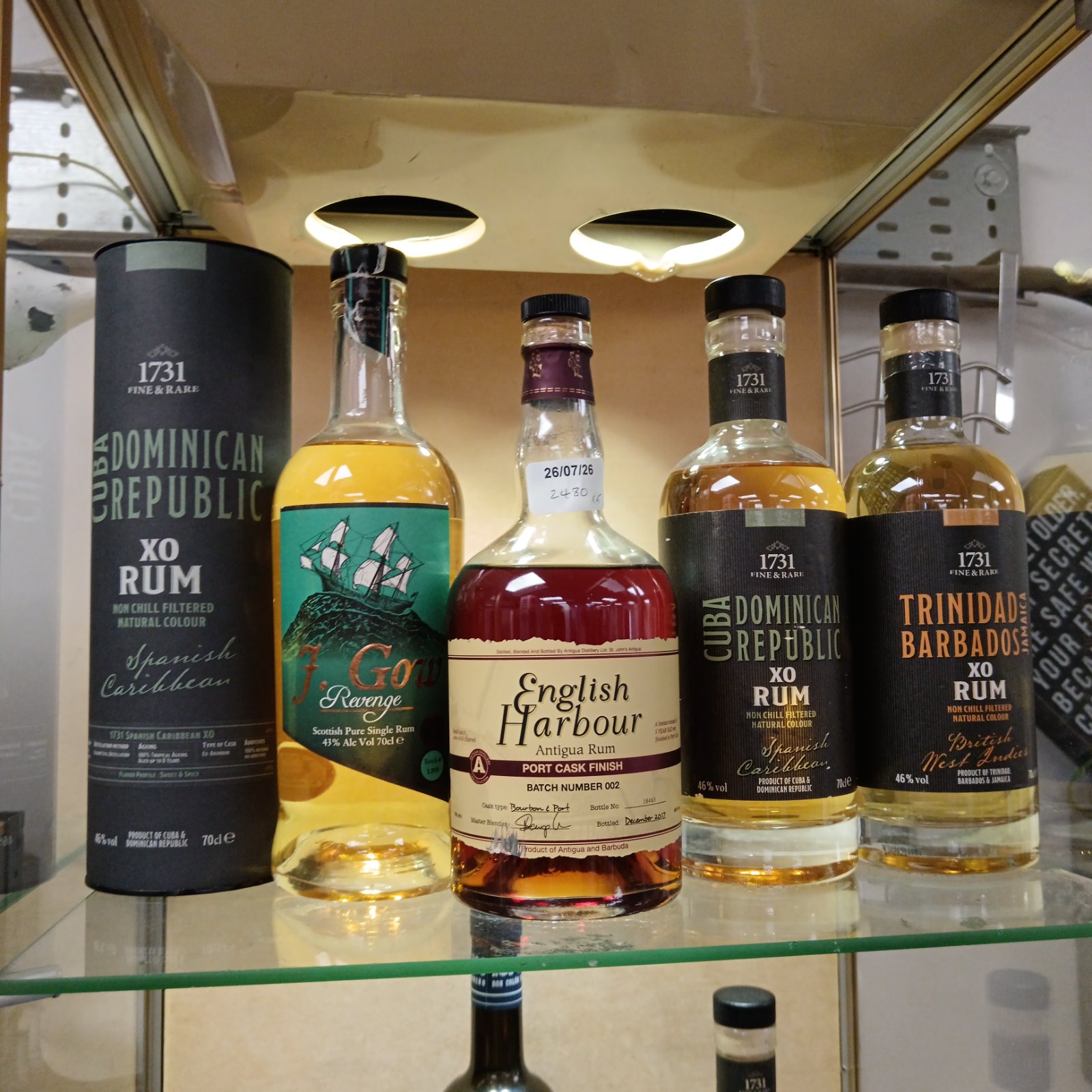 Collection of vintage rum bottles including Cuba, Dominican Republic, and English Harbour.