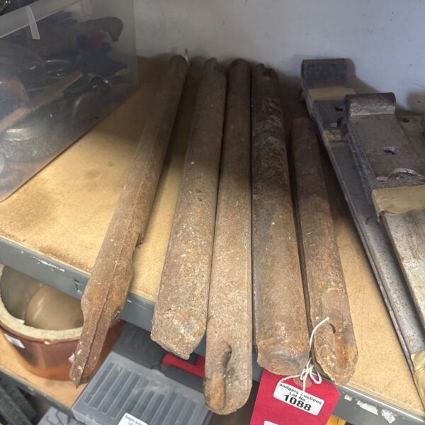 Vintage cast iron sash weights for window restoration.