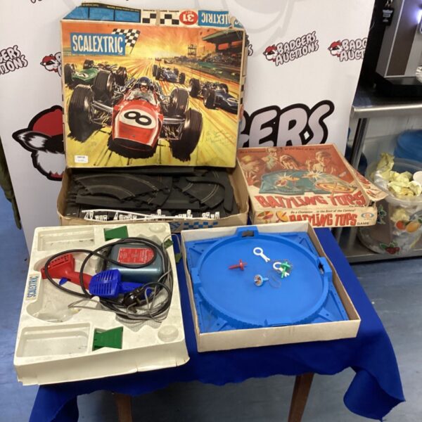 Vintage Scalextric Sports 31 set with Battling Tops game displayed.