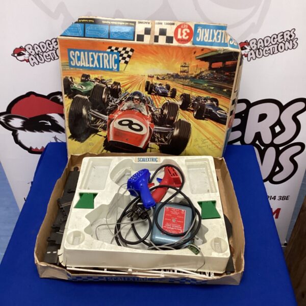 Vintage Scalextric Model 31 racing track with controllers.