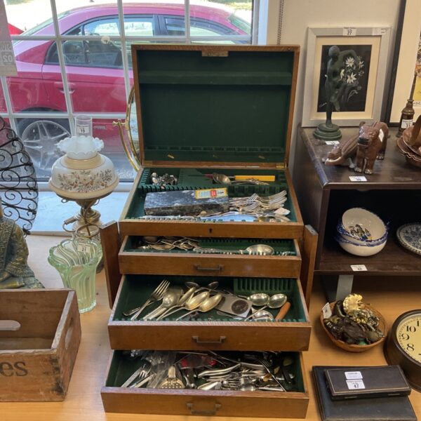 Full view of vintage silver plate cutlery canteen with drawers open.
