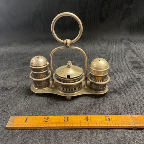 Vintage silverplate cruet set with salt and pepper shakers.